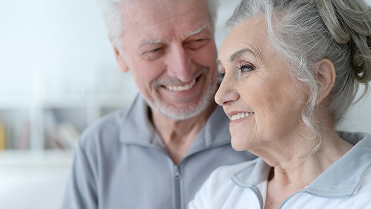  Man and wife happy about moving into a life plan community.